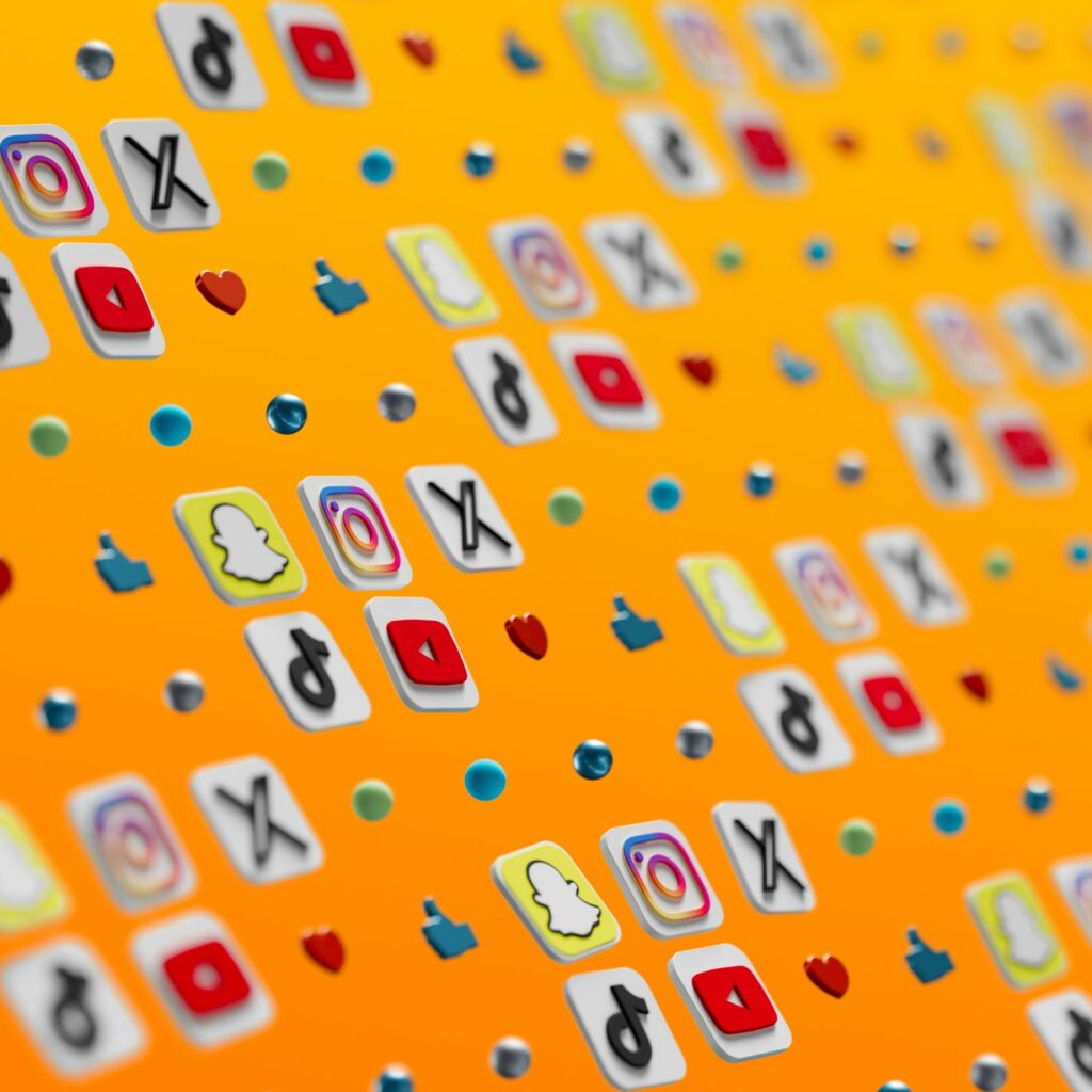 A grid of social media app icons on a yellow-orange background.